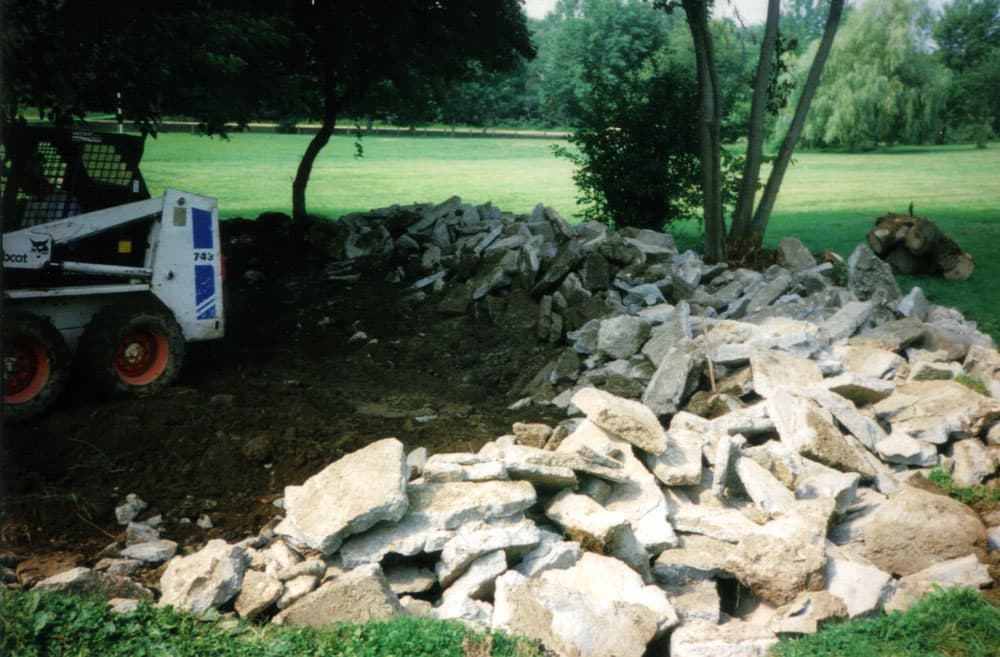 Concrete slab section broken and separated for loader or hand removal from the yard